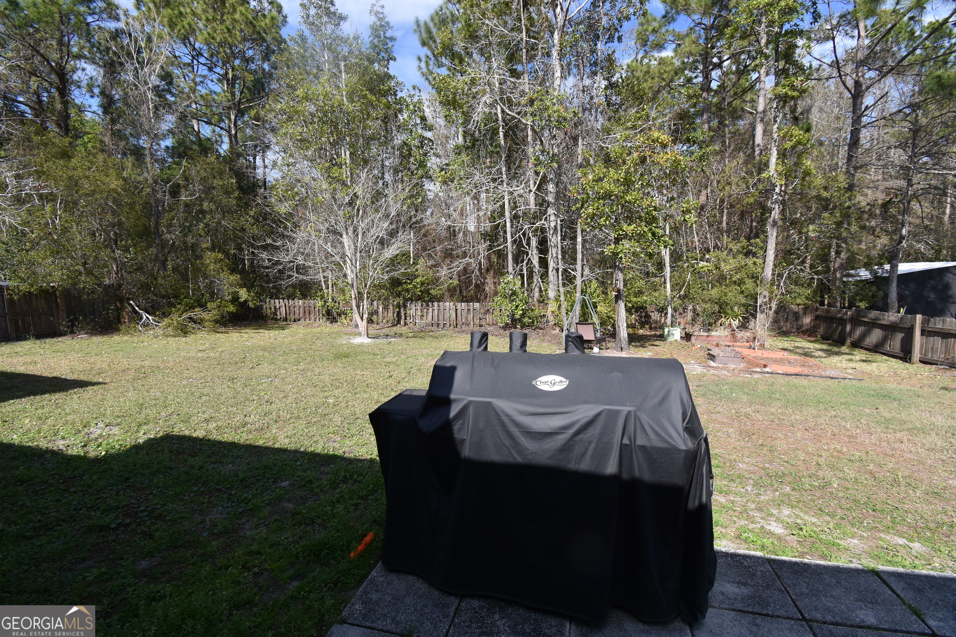 218 Lake Forest Drive Kingsland, GA 31548 - Photo 15 of 17 a view of yard with green space and seating