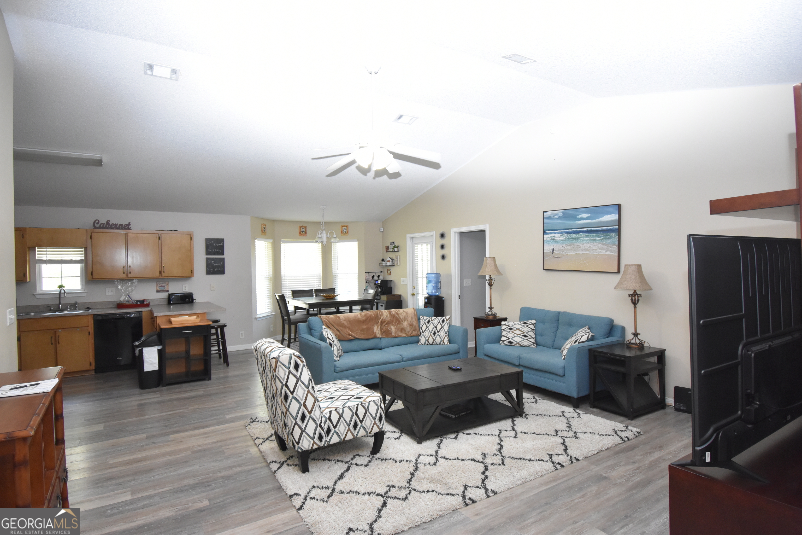 218 Lake Forest Drive Kingsland, GA 31548 - Photo 3 of 17 a living room with fireplace furniture and a wooden floor