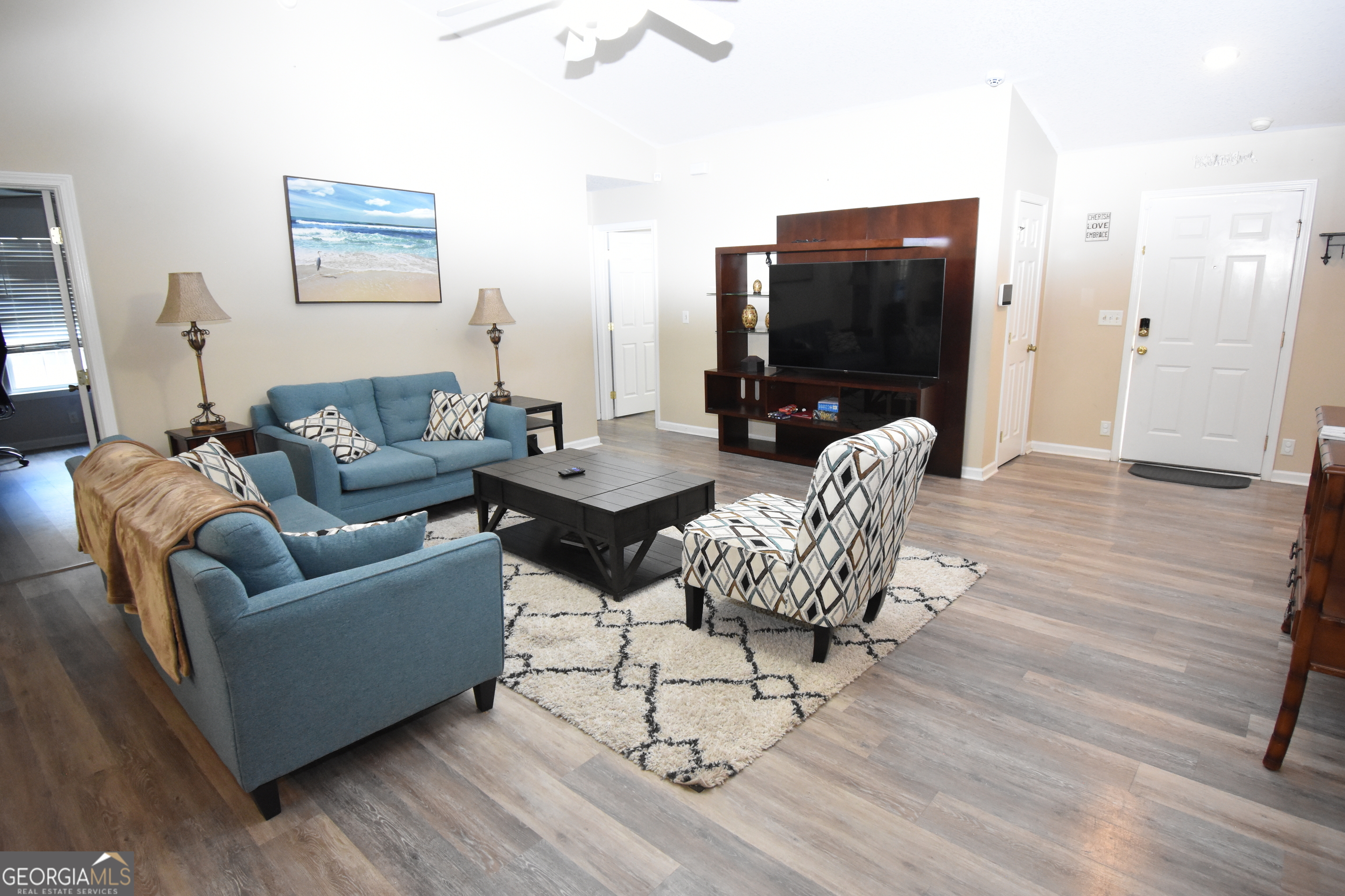 218 Lake Forest Drive Kingsland, GA 31548 - Photo 4 of 17 a living room with furniture and a flat screen tv