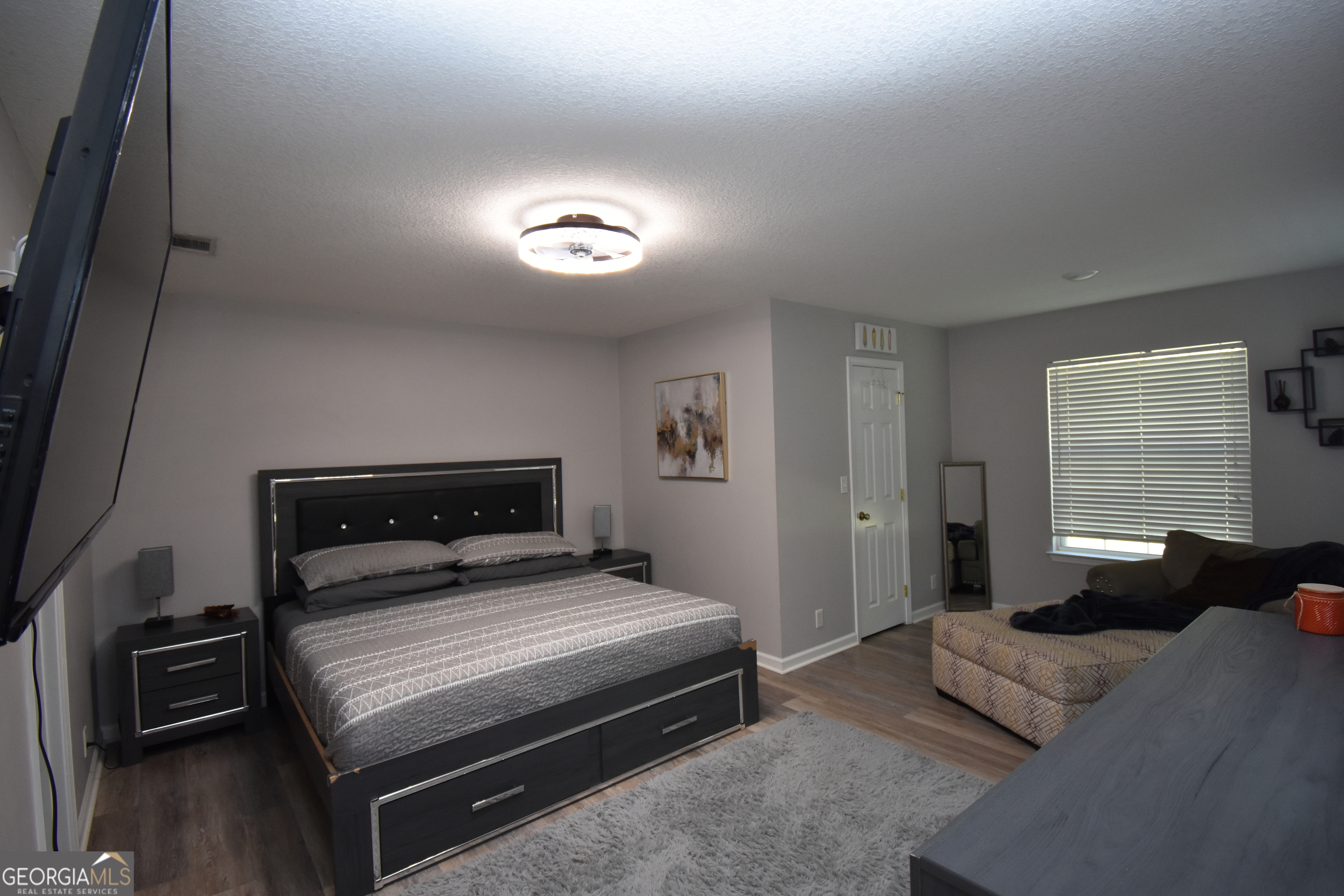 218 Lake Forest Drive Kingsland, GA 31548 - Photo 7 of 17 a bedroom with a bed and a night stand