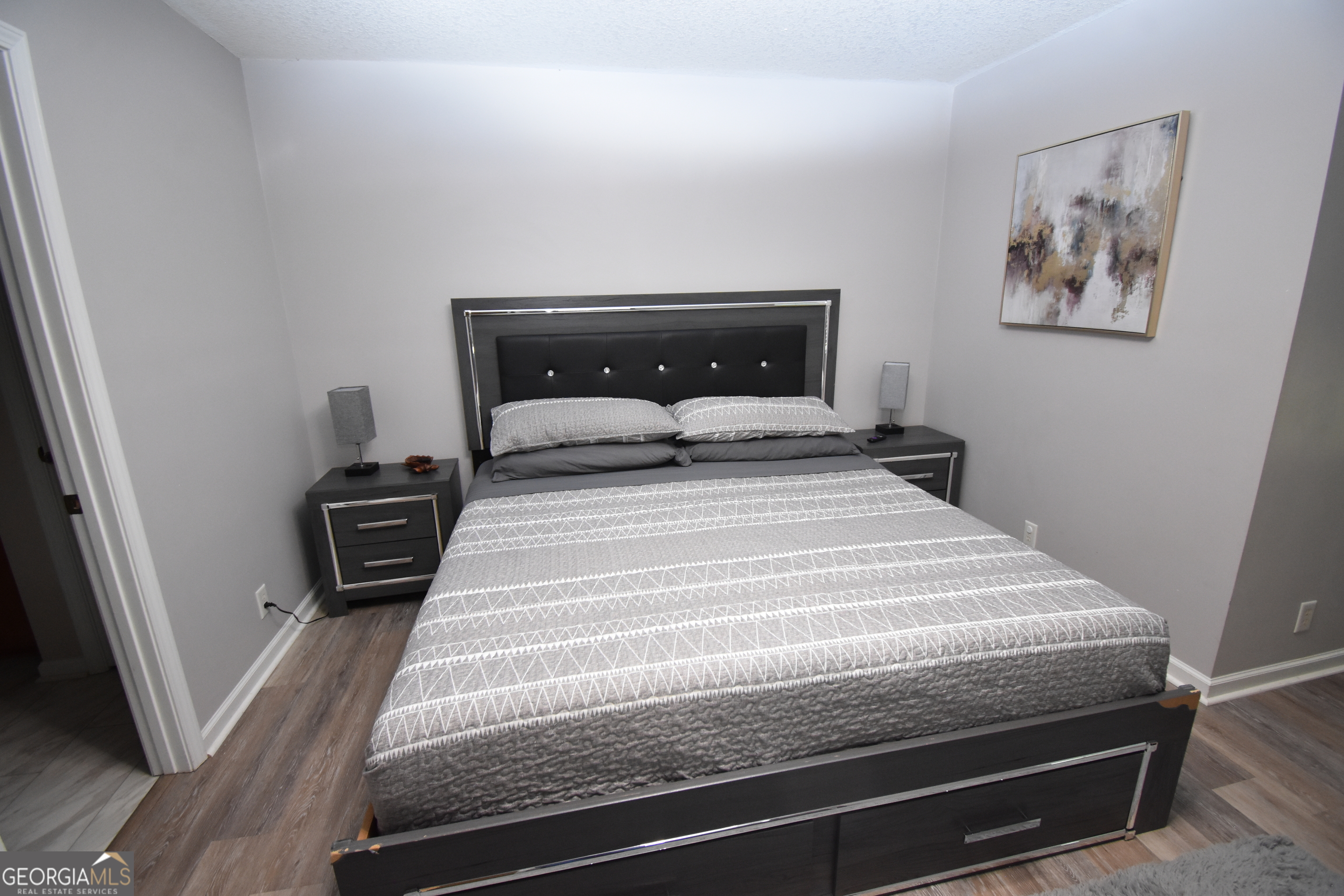 218 Lake Forest Drive Kingsland, GA 31548 - Photo 8 of 17 a bedroom with a bed and a window