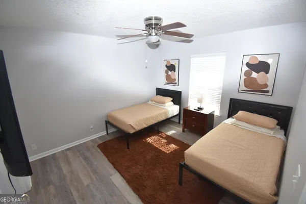 a bedroom with furniture and a chandelier
