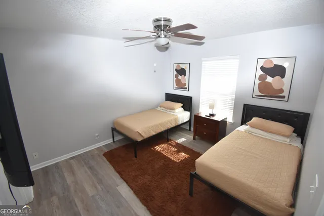 a bedroom with furniture and a chandelier