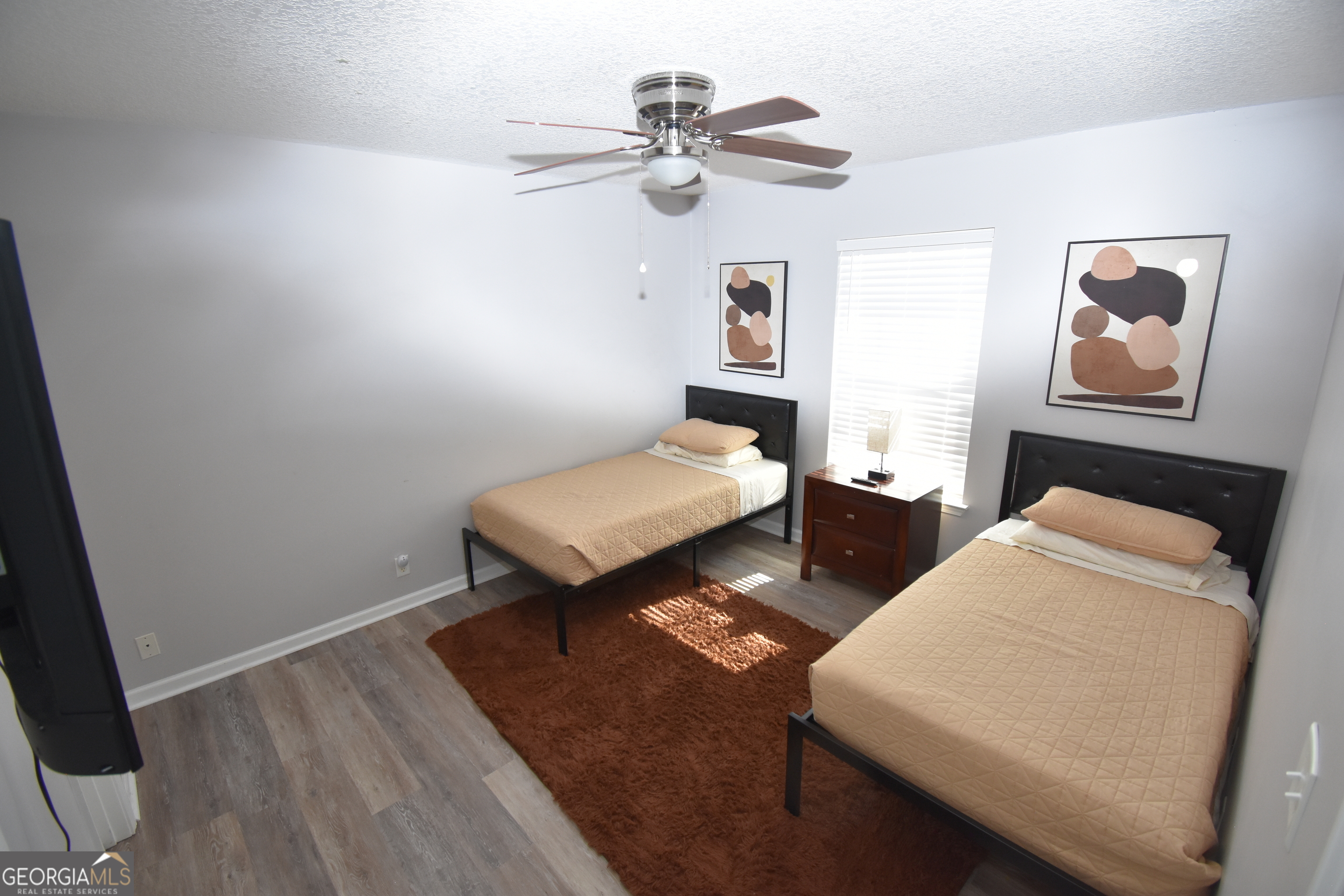 218 Lake Forest Drive Kingsland, GA 31548 - Photo 10 of 17 a bedroom with furniture and a chandelier