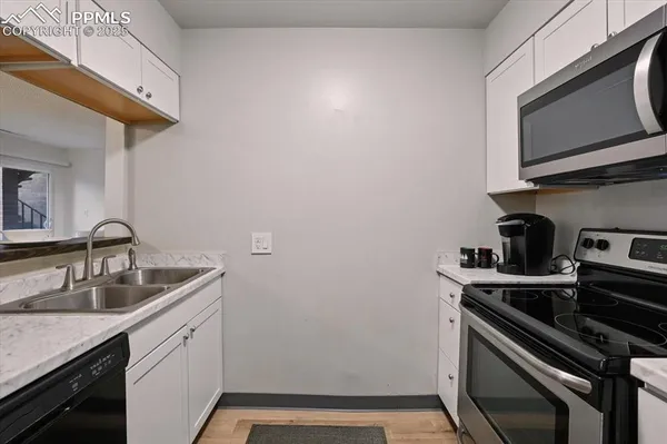 a kitchen with a stove microwave and refrigerator