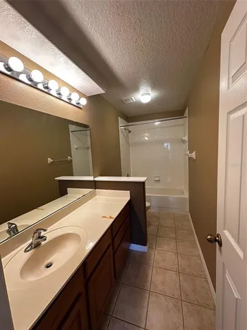 a bathroom with a sink double vanity and a mirror