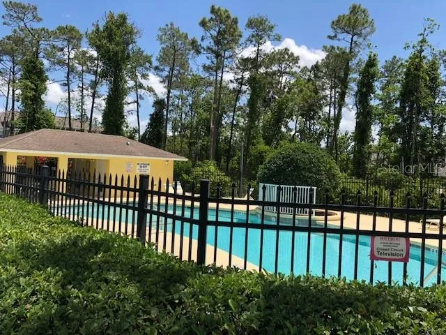 a view of a wrought iron fences in front of house