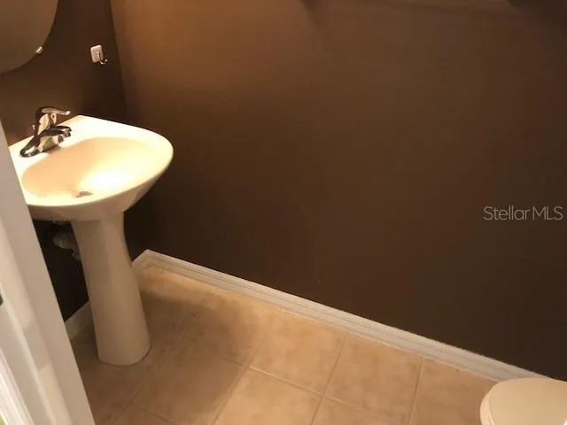 a bathroom with a sink and toilet