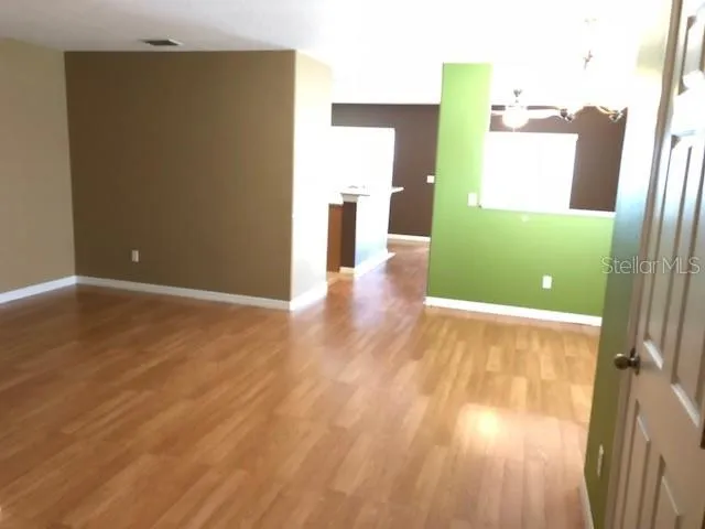 a view of a living room with furniture and a flat screen tv