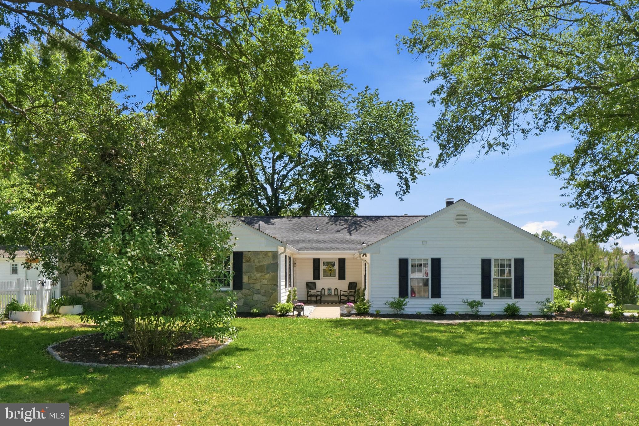 19608 Gott Street Poolesville, MD 20837 - Photo 5 of 43 a front view of a house with a garden