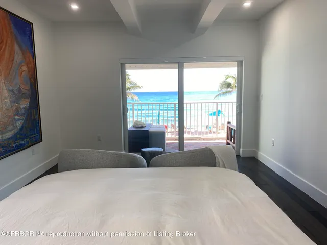 a bedroom with a large bed and a large window