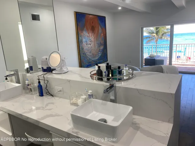 a bathroom with a double vanity sink and a mirror