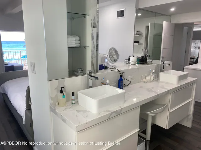 a bathroom with a double vanity sink and a mirror