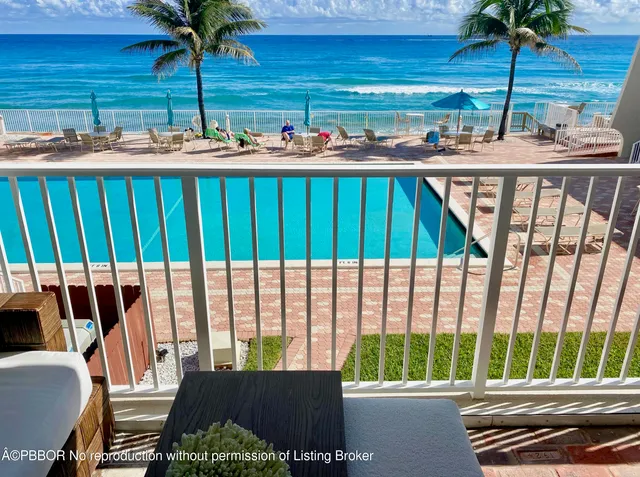 a view of a living room and balcony