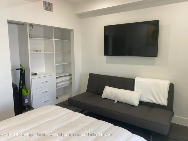 a living room with a couch and a flat screen tv