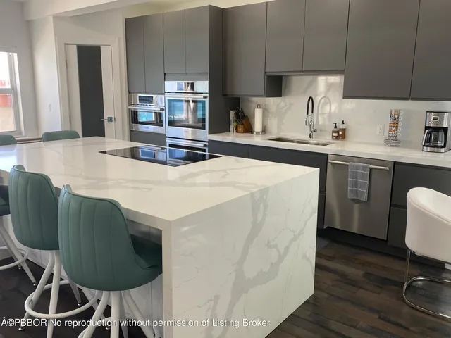 a kitchen with furniture a sink and cabinets