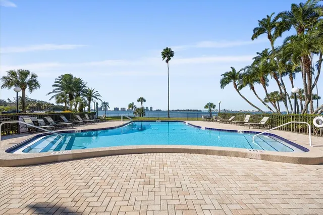 a view of a swimming pool with a lounge chair
