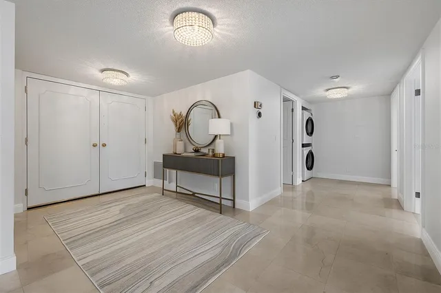 a view of a livingroom with wooden floor and furniture