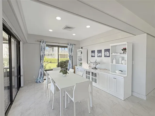 a view of a dining room with furniture window and outside view