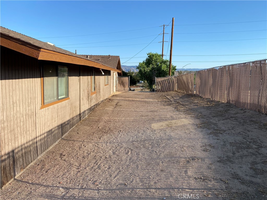 18746 Rock Springs Road Hesperia, CA 92345 - Photo 17 of 21 a view of a house with a yard