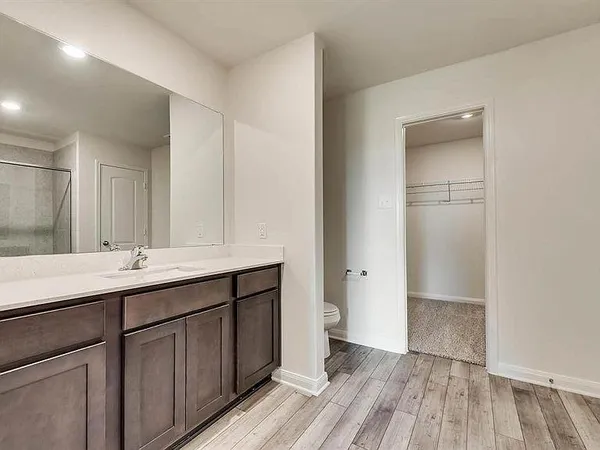 a bathroom with a sink and mirror