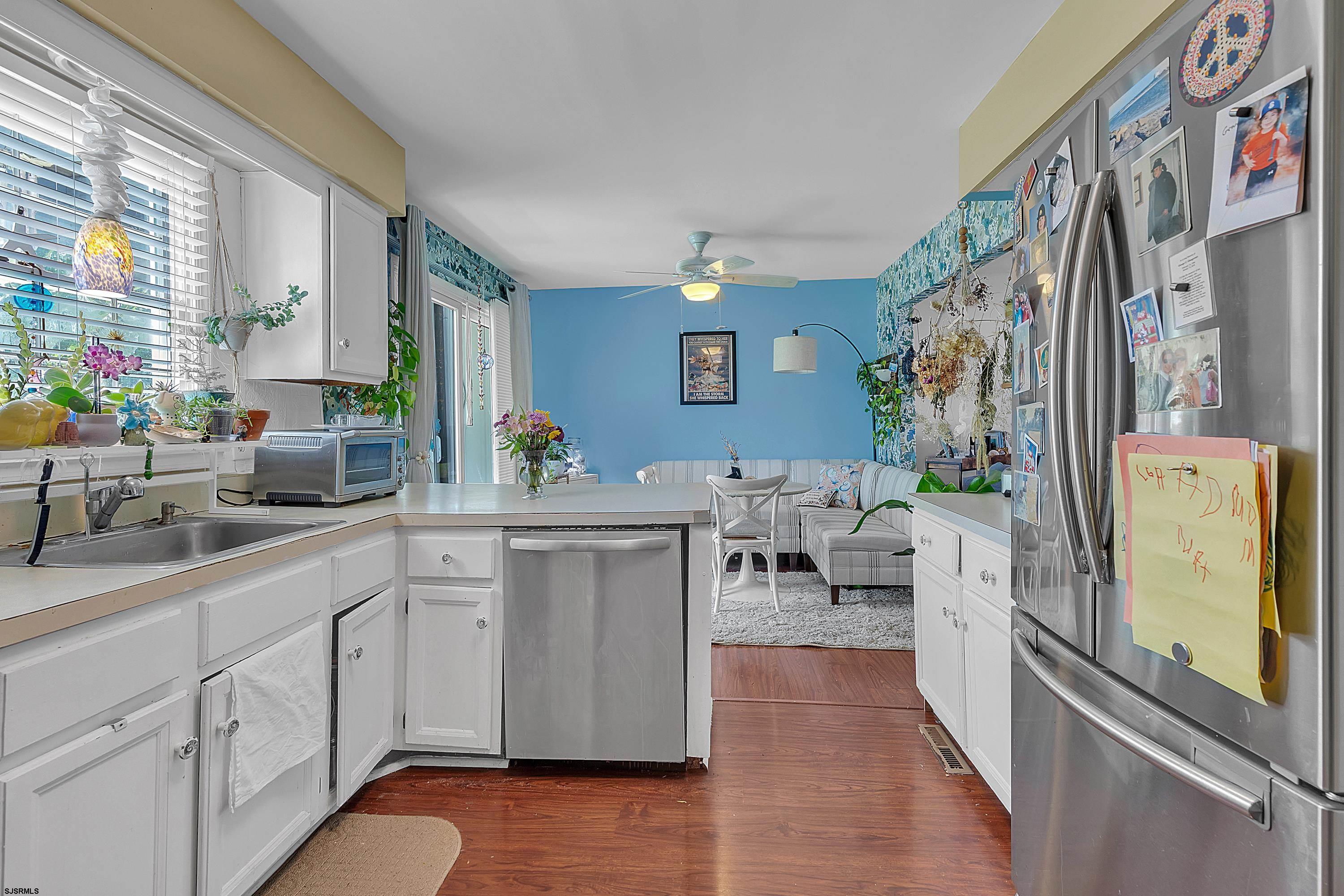 316 Gull Cove Brigantine, NJ 08203 - Photo 12 of 32 a kitchen with stainless steel appliances lots of counter top space and furniture