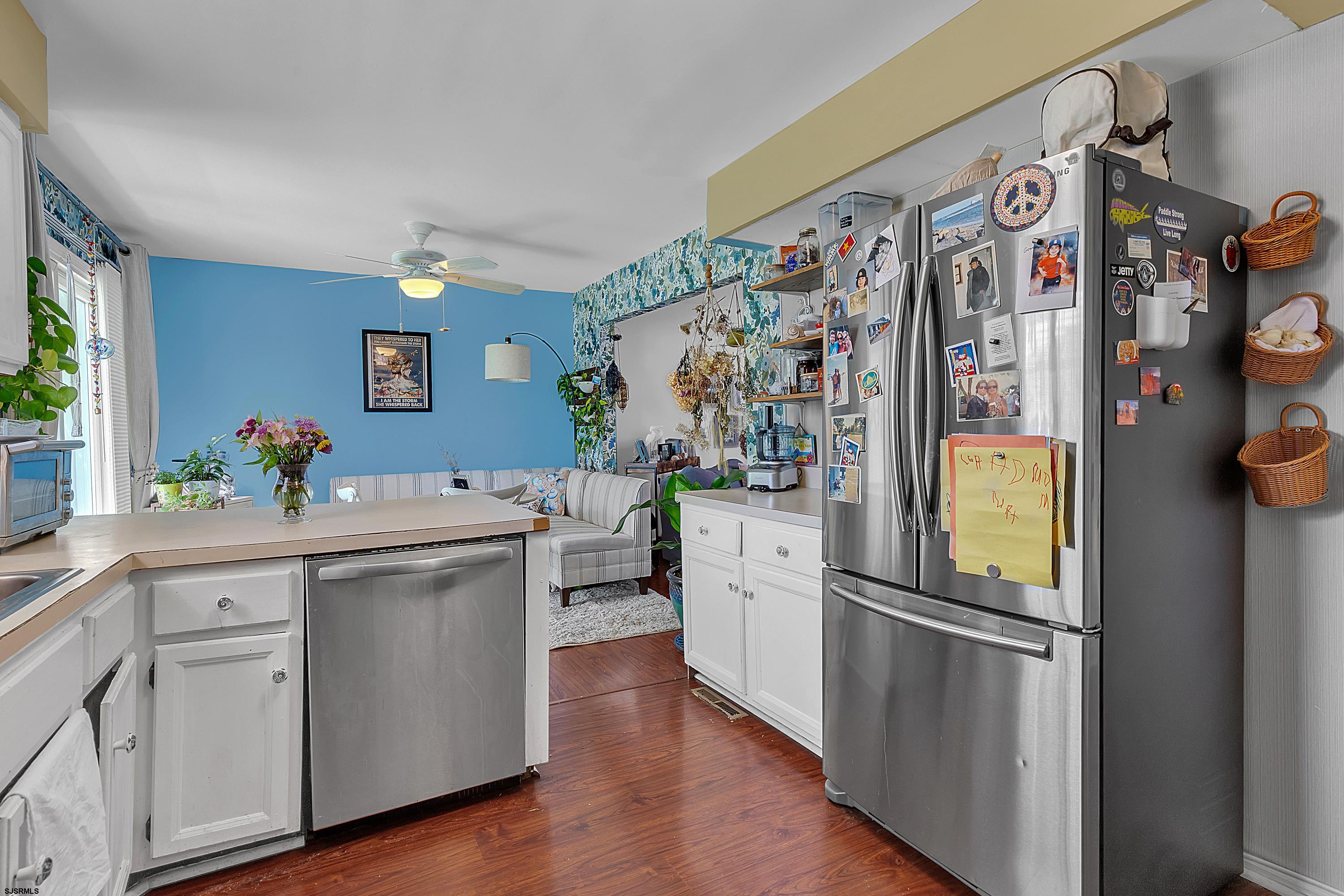 316 Gull Cove Brigantine, NJ 08203 - Photo 13 of 32 a kitchen with stainless steel appliances granite countertop a refrigerator and a sink