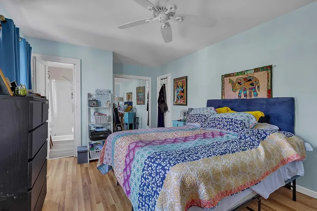 a bed room with a bed and a flat screen tv