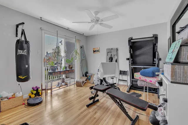 a room with gym equipment and a window