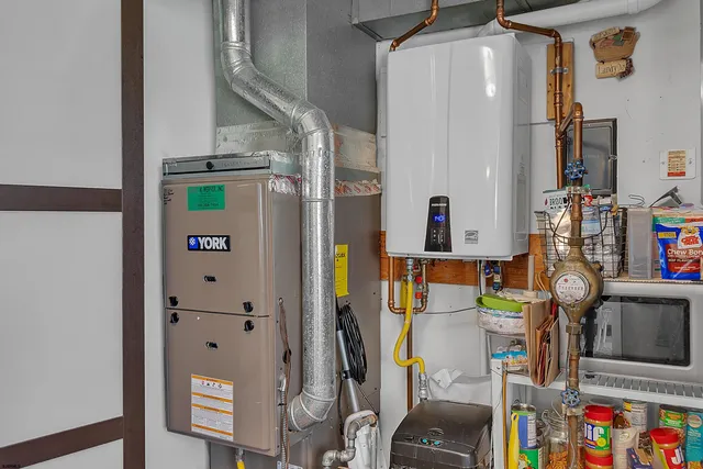 walk in closet with clothes and shoes