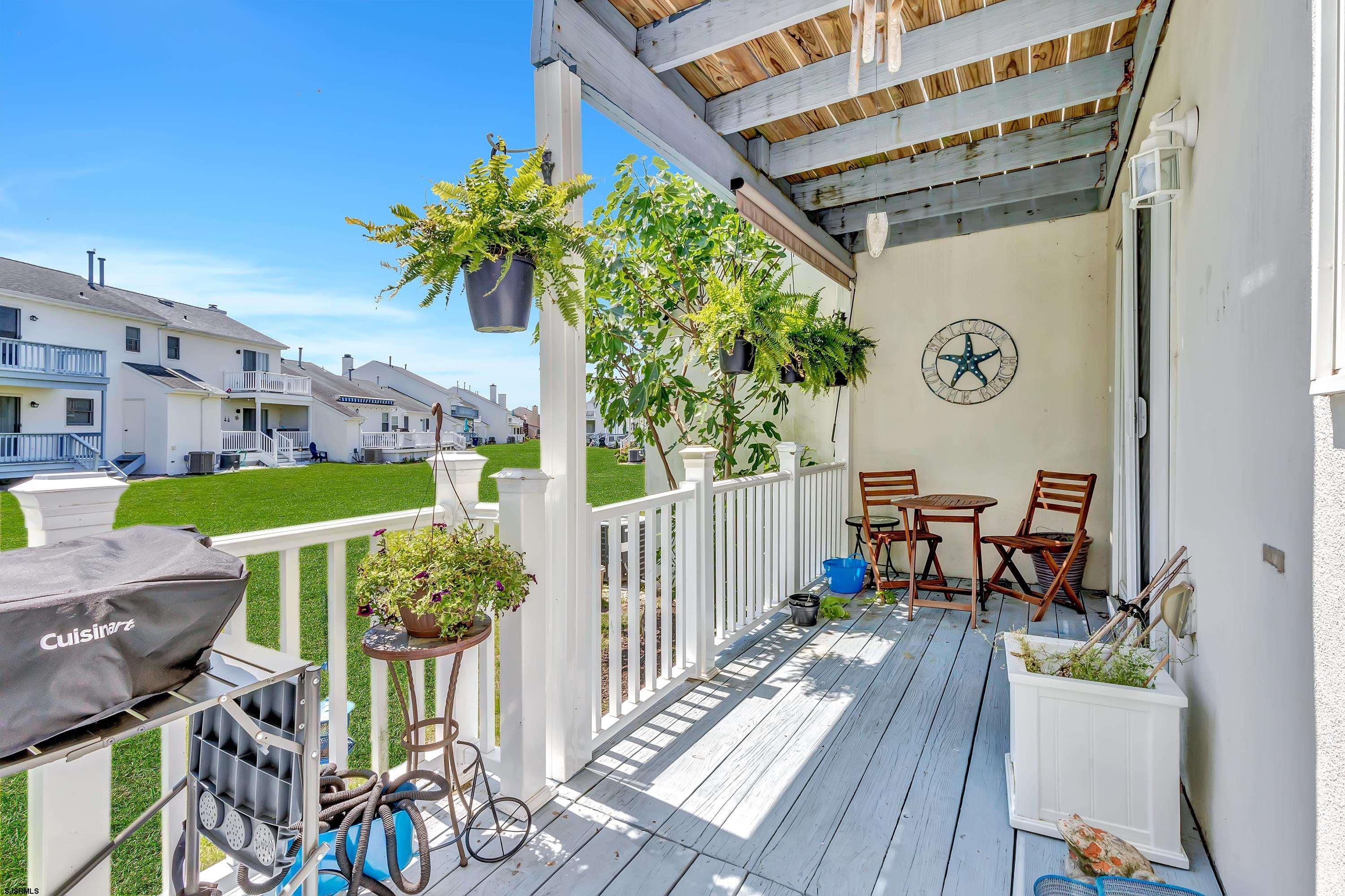 316 Gull Cove Brigantine, NJ 08203 - Photo 22 of 32 a view of balcony with furniture and garden