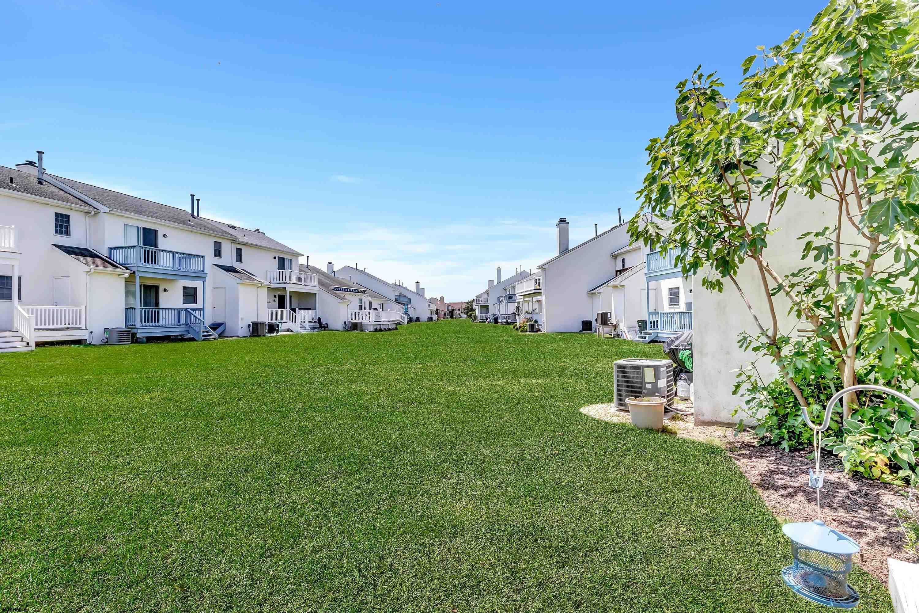 316 Gull Cove Brigantine, NJ 08203 - Photo 24 of 32 a view of a house with a yard