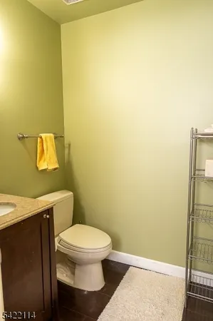 a bedroom with a bed flat screen tv and a window