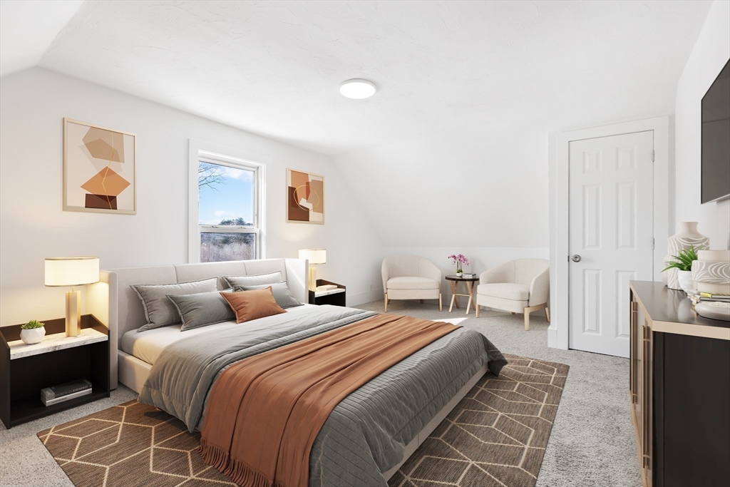 232 Pequoig Avenue, Unit 2 Athol, MA 01331 - Photo 14 of 17 a bedroom with a bed and a couch