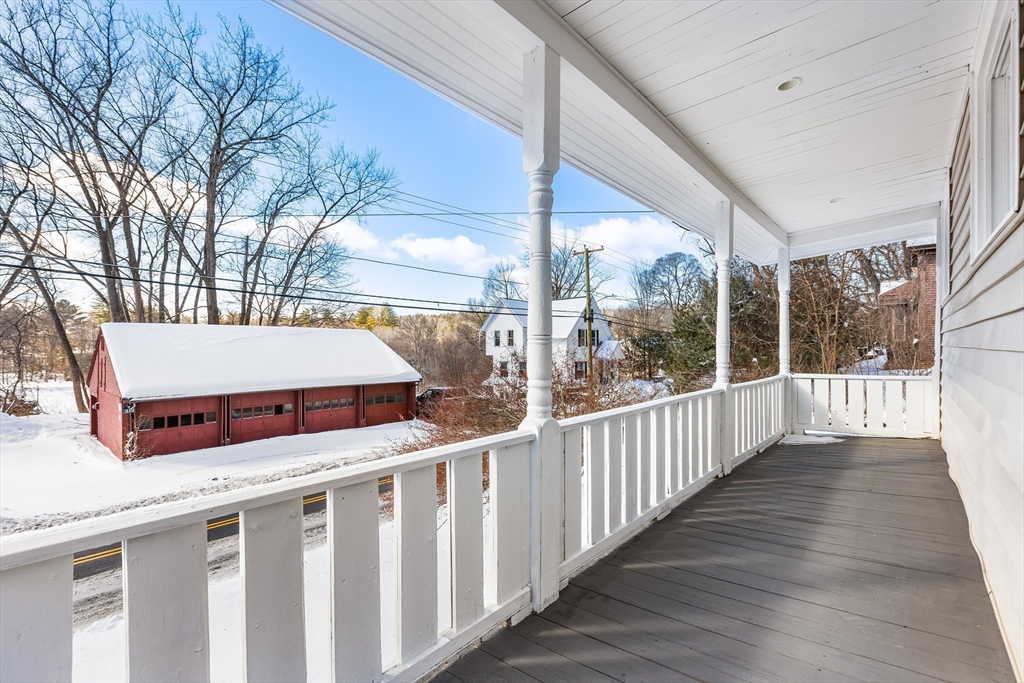 232 Pequoig Avenue, Unit 2 Athol, MA 01331 - Photo 17 of 17 a view of a deck with wooden floor and wooden fence