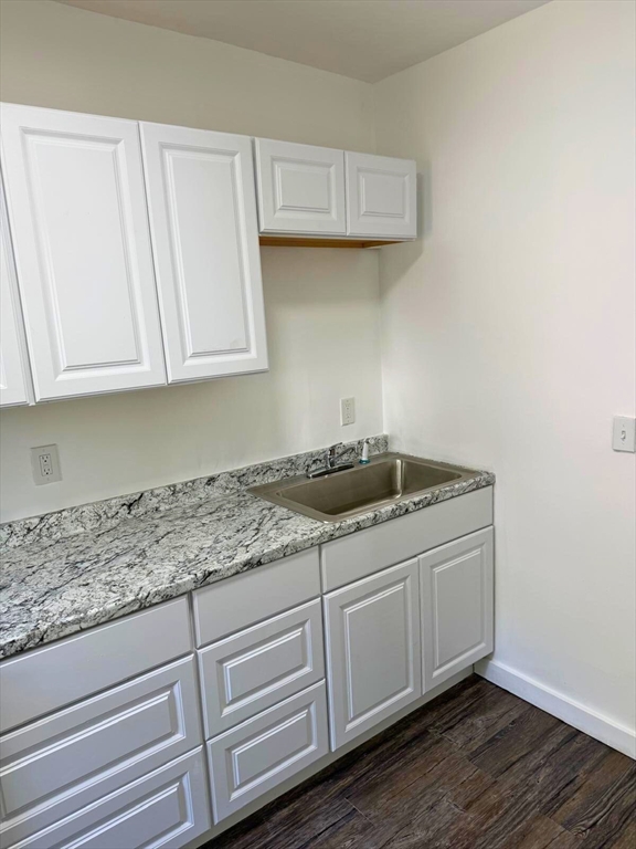 232 Pequoig Avenue, Unit 2 Athol, MA 01331 - Photo 4 of 17 a kitchen with granite countertop cabinets and sink