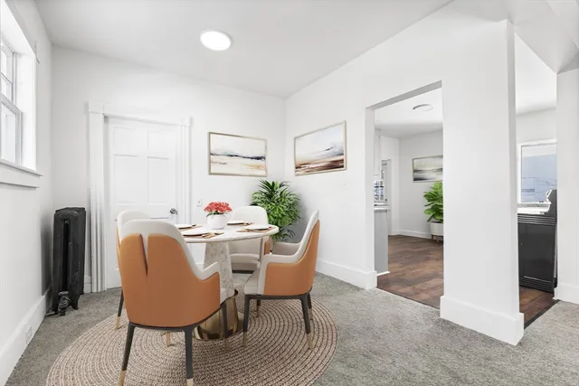 a dining room with furniture and wooden floor