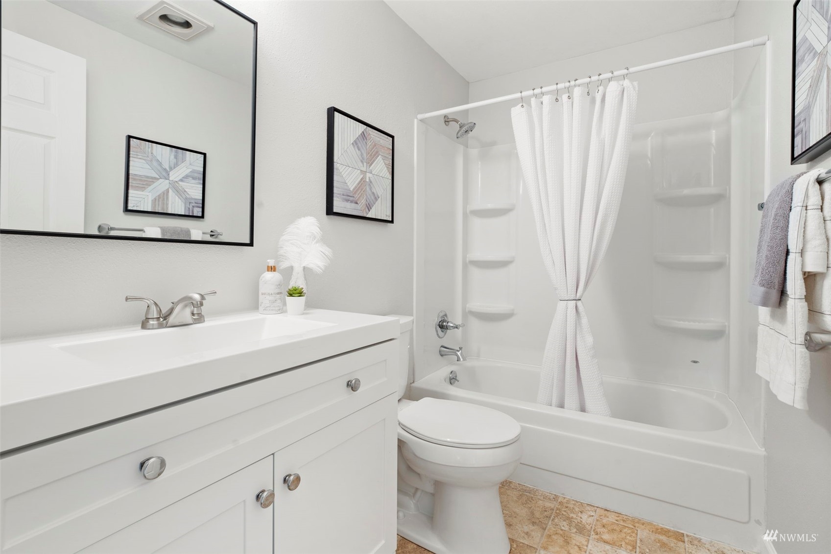 820 Cady Road, Unit F107 Everett, WA 98203 - Photo 16 of 33 a bathroom with a sink a toilet and a mirror