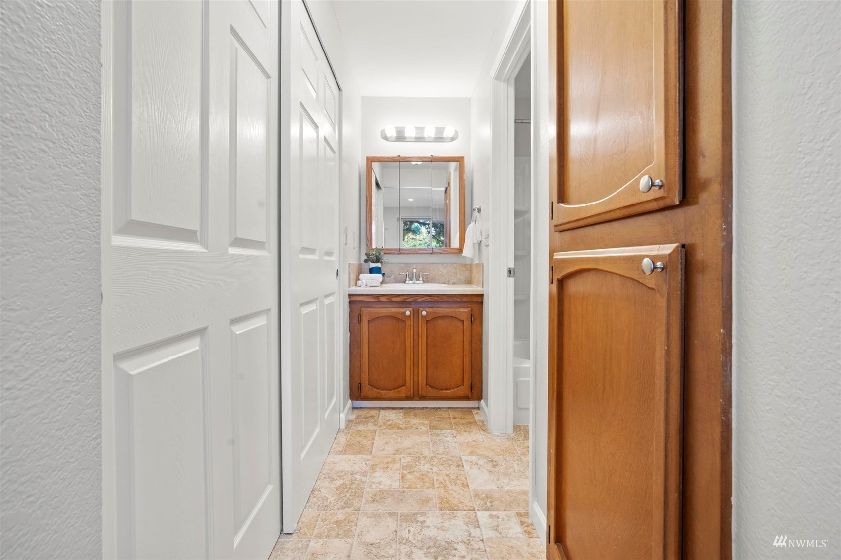 820 Cady Road, Unit F107 Everett, WA 98203 - Photo 25 of 33 a view of a bathroom from the hallway