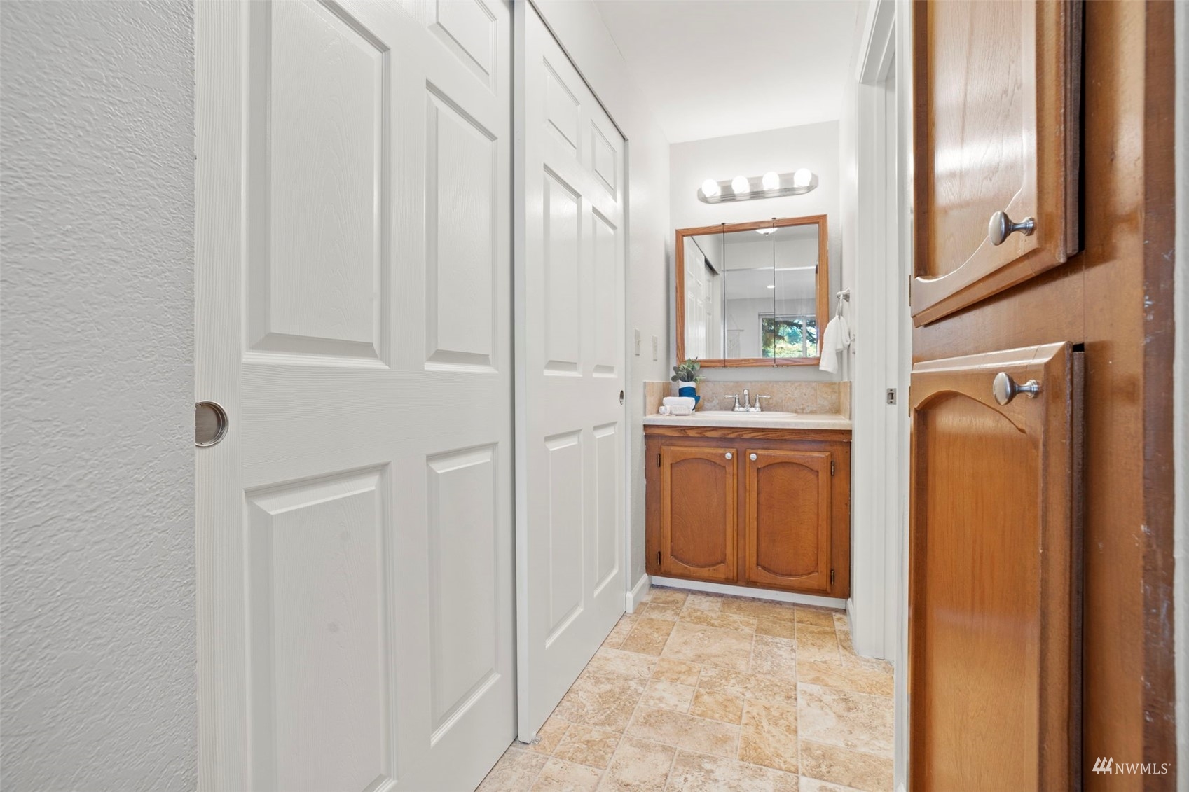 820 Cady Road, Unit F107 Everett, WA 98203 - Photo 26 of 33 a bathroom with a sink and a mirror
