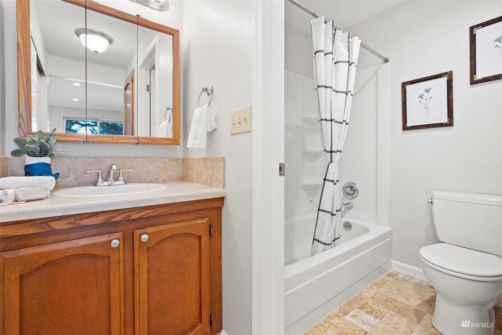 820 Cady Road, Unit F107 Everett, WA 98203 - Photo 27 of 33 a bathroom with a granite countertop sink toilet and shower