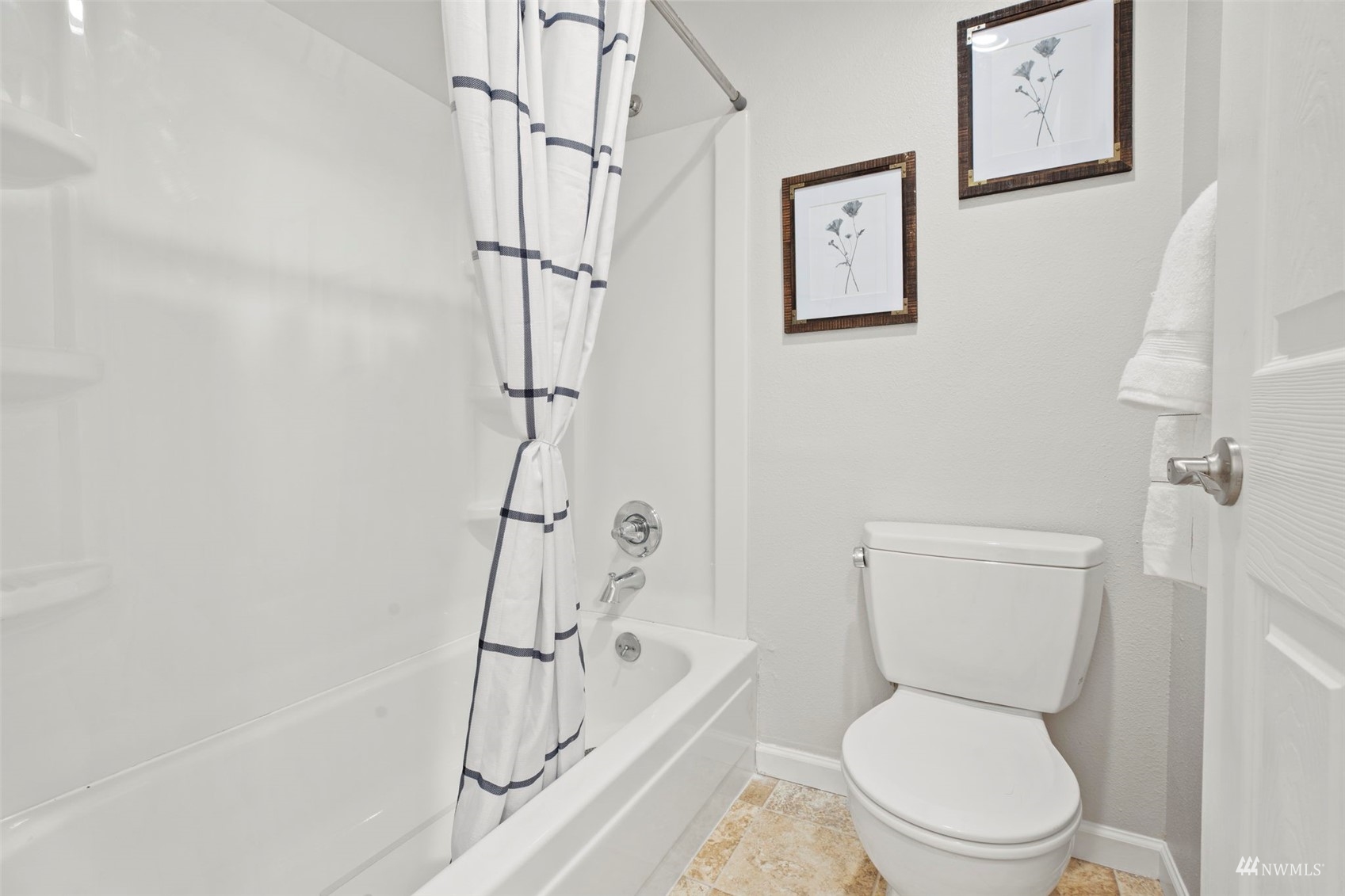 820 Cady Road, Unit F107 Everett, WA 98203 - Photo 28 of 33 a white toilet sitting next to a bath tub shower