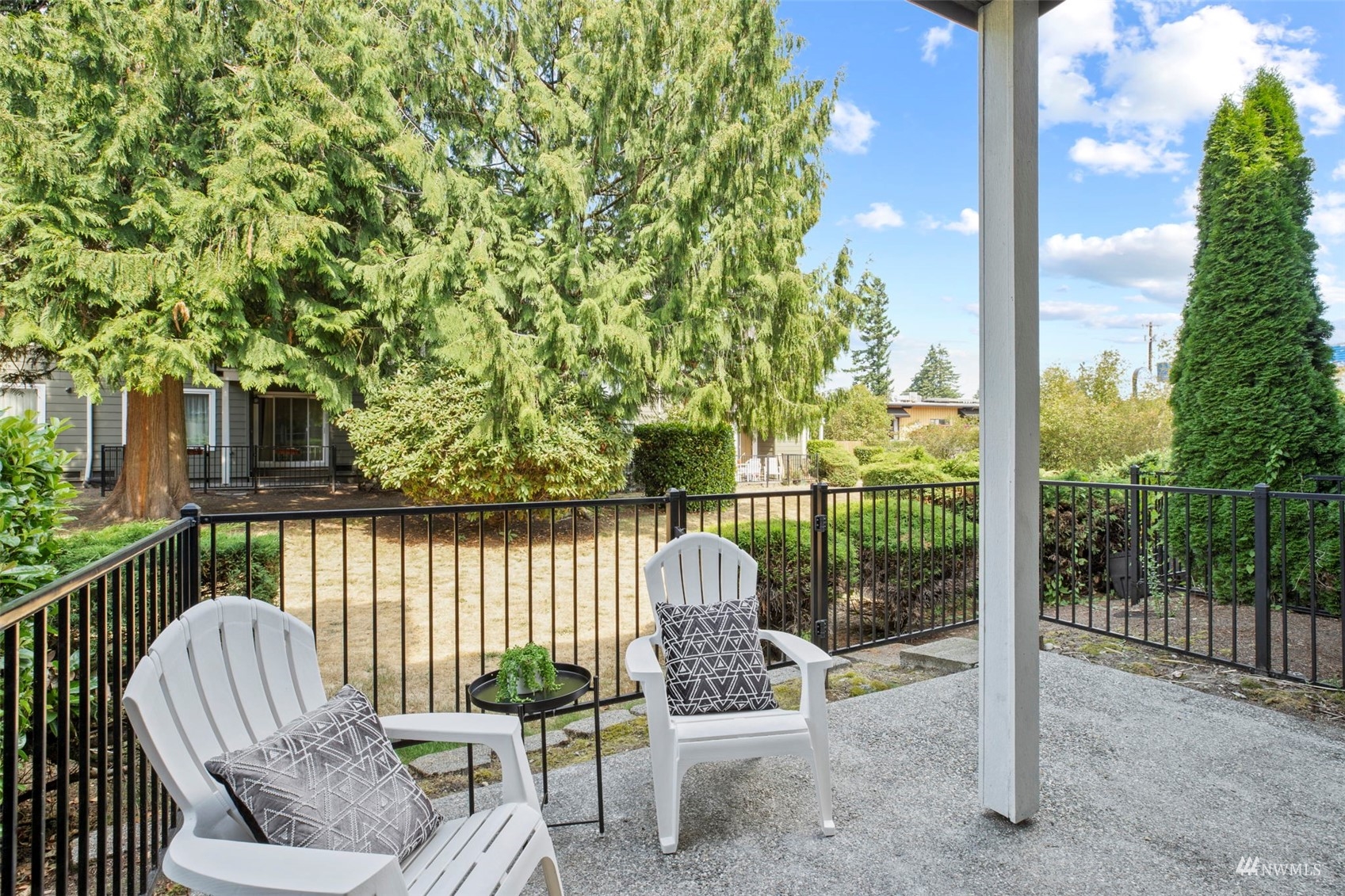 820 Cady Road, Unit F107 Everett, WA 98203 - Photo 29 of 33 a view of a chair and tables in the balcony