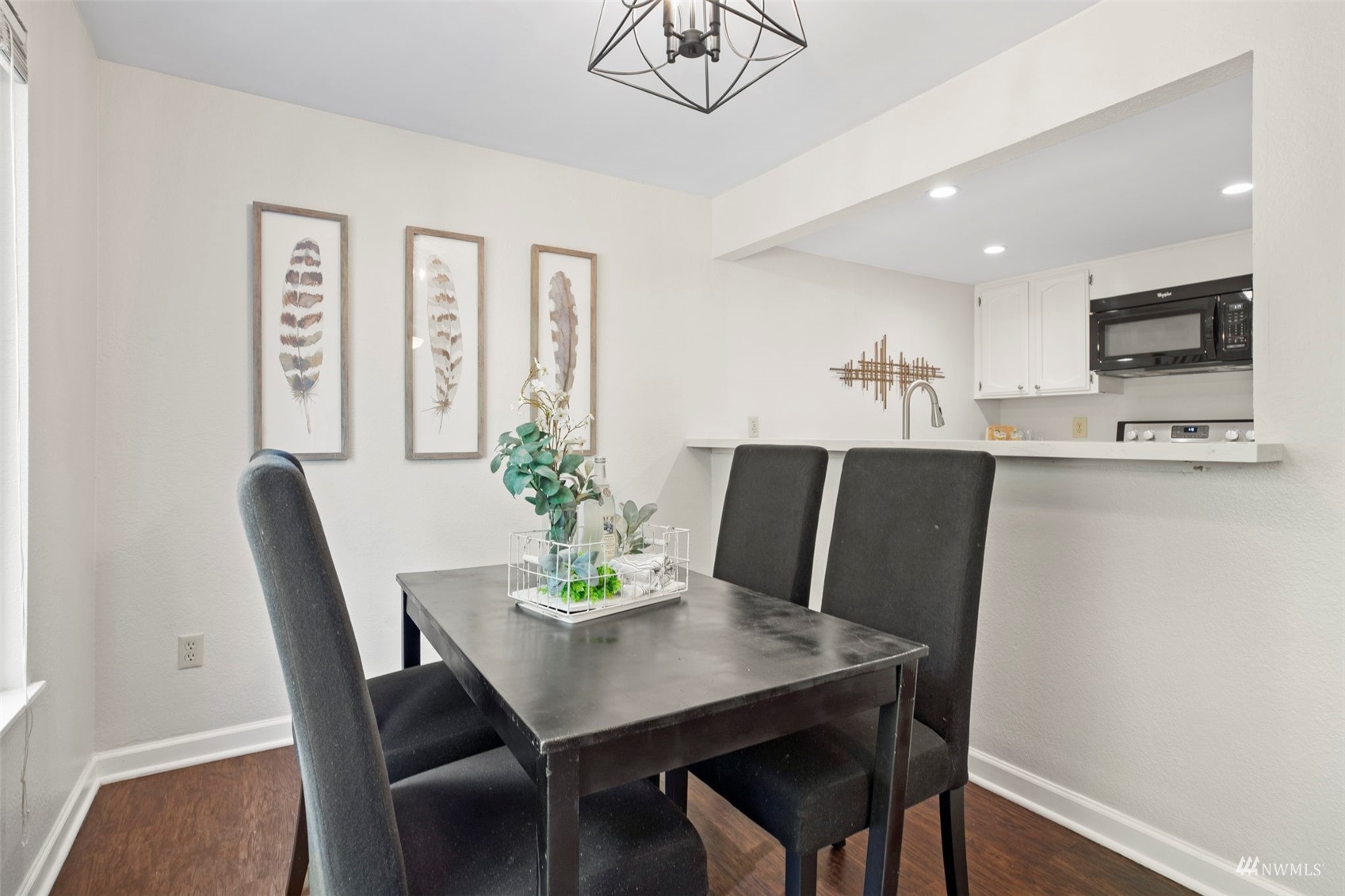 820 Cady Road, Unit F107 Everett, WA 98203 - Photo 8 of 33 a view of a dining room with furniture and wooden floor
