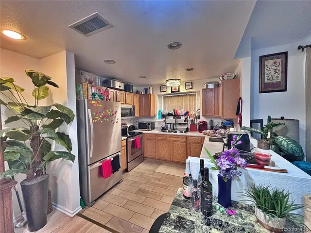 $342,000 | 18986 East 57th Place, Unit A, Denver, CO 80249