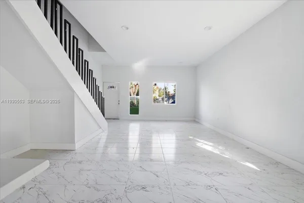 a view of entryway and hall with a window