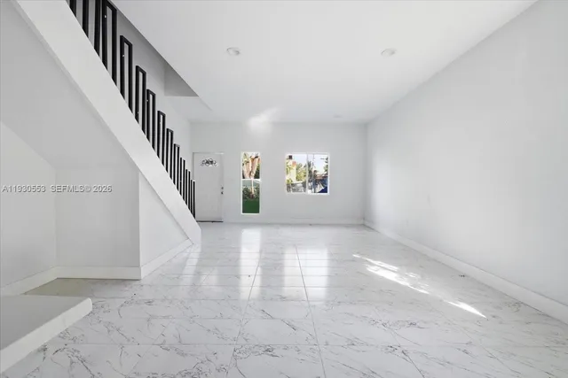 a view of entryway and hall with a window