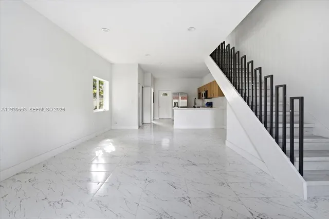 a view of a hallway with staircase