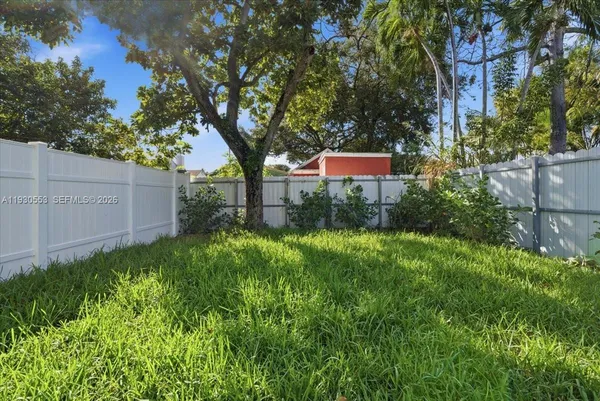 a backyard of a house with lots of green space