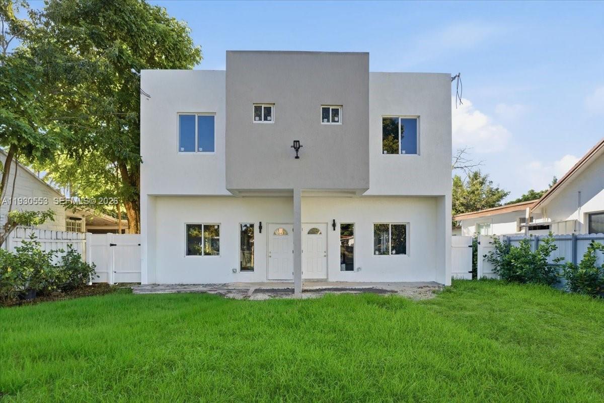 1126 Northwest 28th Street, Unit 1126 Miami, FL 33127 - Photo 20 of 26 front view of house with a yard